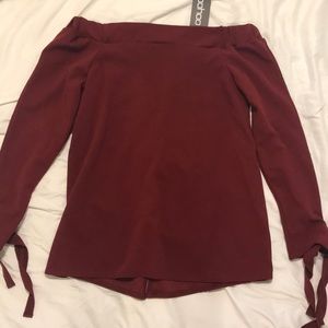 Boohoo off-the-shoulder top + VS sports bra